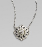 From the Windsor Collection. A lacy medallion combining graphic shapes, delicate granulation and the sparkle of white sapphires hangs from a graceful chain of textured links. White sapphires Sterling silver and 18k yellow gold Chain length, about 17 Pendant diameter, about 1 Lobster clasp Imported