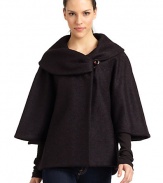 THE LOOKDramatic portrait collar with button closureThree-quarter length cape sleevesButton closures at sidesTHE FITAbout 27 from shoulder to hemTHE MATERIALFleece wool/nylonFully linedCARE & ORIGINDry cleanMade in ItalyModel shown is 5'9 (175cm) wearing US size 4. 