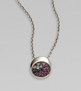 From the Eclipse Collection. A chunky round disc paved with an array of faceted gemstones sits within a sleek setting of polished sterling silver on a silver chain.Blue sapphires, sky blue topaz, iolite and rhodoliteSterling silverChain length, adjusts from about 16-18Pendant diameter, about ½Lobster claspImported