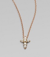 A petite cross that sparkles with diamonds in 18k rose gold on a chain link necklace. Diamonds, .11 tcw18k goldLength, about 16 to 18 adjustablePendant size, about ¼ Lobster clasp closureMade in Italy