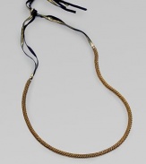 A fine herringbone chain with a gilded grosgrain ribbon tie.Brass Grosgrain ribbon Adjustable ties About 25½ long Imported