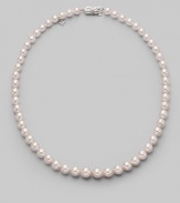 A classic strand of graduated white Akoya pearls with a pretty filigree clasp. 7mm- 9mm white round cultured pearls Quality: A1 18k white gold Length, about 18 Mikimoto signature clasp Imported