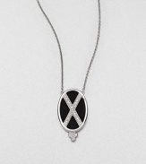 From the Soho Collection. Rich black spinels accented with a white sapphire criss cross design set in sterling silver on a delicate link chain. Black spinel and white sapphireSterling silver Length, about 16Pendant size, about 1.2Lobster clasp closureImported 