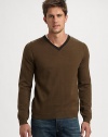 Contrast trim along the neckline defines this essential pullover sweater, shaped in a sumptuous wool blend.V-neckRibbed knit cuffs and hem50% wool/25% camel hair/25% nylonHand washImported