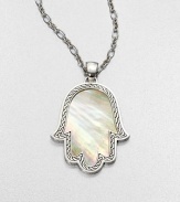 A mano di fatima pendant in iridescent mother-of-pearl surrounded by intricately designed sterling silver on a link chain. Mother-of-pearlSterling silverLength, about 18 to 20 adjustablePendant size, about 2.5Lobster claspImported 