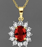 Regal and resplendent. An oval-cut ruby (1-1/8 ct. t.w.) and round-cut diamond accents adorn this royalty-inspired pendant. Crafted in 14k gold. Approximate length: 18 inches. Approximate drop: 5/8 inch.