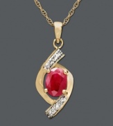 Adorn your neckline with a vibrant crimson hue. This pendant features an oval-cut ruby (3/4 ct. t.w.) and round-cut diamond accents set in 14k gold. Approximate length: 18 inches. Approximate drop: 3/4 inch.