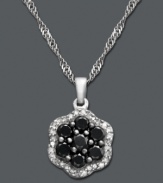 Add a touch of elegance and a drop of bold color. This versatile pendant features seven black diamonds (7/8 ct. t.w.) surrounded by a halo of round-cut white diamonds (1/6 ct. t.w.). Crafted in sterling silver. Approximate length: 18 inches. Approximate drop: 1/2 inch.