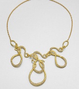 From the Elements Siyabona Collection. A modern melange of swirling loops and squiggles, in textured goldtone set with tiny Swarovski crystals for a subtle shimmer, hanging from a delicate golden chain.CrystalGoldtoneLength, about 18Lobster claspMade in USA