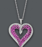 Better than any Valentine, this sparkling heart pendant will really show her you care. Crafted from sterling silver, a cut-out heart features round-cut rubies (2-1/2 ct. t.w.) and diamonds (1/3 ct. t.w.). Approximate length: 18 inches. Approximate drop: 5/8 inch.