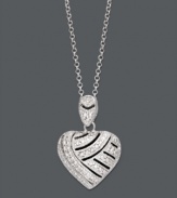 A look you'll simply adore. Victoria Townsend's lovable heart pendant shines with the addition of sparkling diamonds accents. Setting and chain crafted in sterling silver. Approximate length: 18 inches. Approximate drop: 8/10 inch.