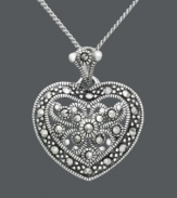 Love knows no boundaries. Express it in flawless style by Genevieve & Grace. Pendant features a gorgeous filigree heart accented by round-cut marcasite in sterling silver. Approximate length: 18 inches. Approximate drop: 7/8 inch x 3/4 inch.