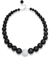 Embolden your look. Matte black agate (520 ct. t.w.) and a textured sterling silver bead make any look pop on this dramatic necklace. Beads strung on a silk cord. Approximate length: 19 inches + 3-inch extender.