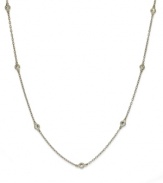 Inch by inch of luminous sparkle. B. Brilliant's delicate necklace features nine round-cut cubic zirconia stations (9/10 ct. t.w.) set in 18k gold over sterling silver. Approximate length: 24 inches.