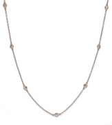 Inch by inch of luminous sparkle. B. Brilliant's delicate necklace features nine round-cut cubic zirconia stations (9/10 ct. t.w.) set in 18k gold over sterling silver. Approximate length: 20 inches.