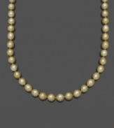 Like drops of gold washed onto the beach, this extraordinary pearl necklace features oval-shaped south sea pearls (10-12 mm) set in 14k gold. Approximate length: 18 inches.