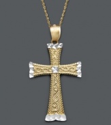 A versatile two tone cross pendant in design to last a lifetime. Crafted in 14k gold and 14k white gold, cross features an engraved scroll pattern and diamond-cut accents. Approximate length: 18 inches. Approximate drop width: 1 inch. Approximate drop length: 1-1/2 inches.