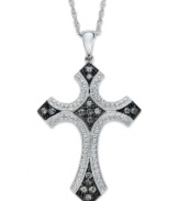 A stunning cross pendant with medieval flair. Set in sterling silver with touches of black rhodium, this cross glistens with the addition of round-cut diamonds (1/4 ct. t.w.). Approximate length: 18 inches. Approximate drop: 1-1/2 inches.