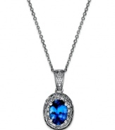 True shine. Indulge in this sophisticate piece featuring an oval-cut tanzine (3/4 ct. t.w.) surrounded by sparkling diamond accents. Necklace set in sterling silver. Approximate length: 18 inches. Approximate drop: 5/8 inch.