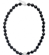 A traditional style with bold, modern appeal. This chunky strand necklace showcases faceted onyx beads (10 mm) and a sparkling crystal ball at center (12 mm). Clasp crafted in sterling silver. Approximate length: 18 inches + 1-inch extender.