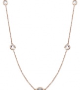 Layer yourself with inches of sparkle. This delicate necklace is crafted in 14k rose gold over sterling silver, with round-cut white topaz stations (4 ct. t.w.). Approximate length: 17 inches.