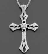 A traditional sterling silver cross pendant with ornate and delicate details featuring round-cut diamonds (1/5 ct. t.w.) for a pretty shimmer. Chain measures 18 inches; drop measures 2 inches.