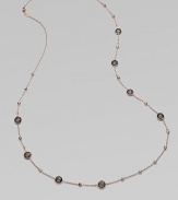 This 18k gold and sterling silver design is plated in 18k rose gold with faceted smokey quartz stations for a simply luxurious look. 18k gold and sterling silver with 18k rose goldplatingSmokey quartzLength, about 37Lobster clasp closureImported 