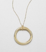 Radiant 18k gold in a wrapped circle design on a delicate link chain. 18k goldLength, about 31Pendant size, about 1.5Lobster clasp closureMade in Italy