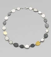 From the Contour Collection. Delicate, free-form discs of hammered sterling silver with light and dark finishes are linked together and accented by discs of 24k gold.Sterling silver and 24k yellow goldLength, about 18Lobster claspImported