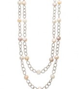 A long, luxurious layer. Pink and white cultured freshwater pearls (9-11 mm) adorn this oval link chain in polished sterling silver. Approximate length: 72 inches.