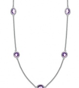 Traditionally stylish. This delicate sterling silver necklace adds just the right pop of color with oval and round-cut amethyst stations (4 ct. t.w.). Secures with a lobster claw clasp. Approximate length: 17 inches.