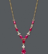 Brighten your look with elaborate design and bold hues. This intricate, y-shaped necklace highlights oval and pear-cut rubies (2-5/8 ct. t.w.) combined with the sparkle of round-cut diamonds (1/10 ct. t.w.). Set in 14k gold. Approximate length: 19 inches. Approximate drop: 1-1/2 inches.