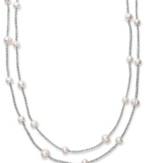 True treasures of the deep. Cultured freshwater pearls (8-10 mm) make a strong statement upon intricately woven silver tone polyester thread. Necklace is long enough to wrap twice for added volume. Approximate length: 64 inches.