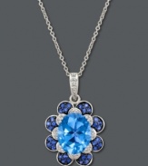 A true blue sensation. Le Vian's cool pendant features a beautiful flower shape with an oval-cut blue topaz at center (3-9/10 ct. t.w.) surrounded by petals decorated with diamonds (1/10 ct. t.w.) and sapphires (1/3 ct. t.w.). Set in 14k white gold. Approximate length: 18 inches. Approximate drop: 1 inch.