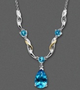 Swirls of 14k gold and sterling silver surround vibrant blue topaz gemstones (4-3/8 ct. t.w.).  Necklace features a teardrop design and includes diamond accents. Approximate length: 14 inches. Approximate drop: 1/2 inch.