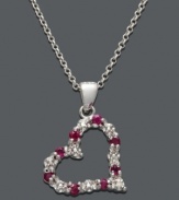 The perfect way to express your love. This open-cut heart pendant by Victoria Townsend features bright red rubies (1/3 ct. t.w.) and sparkling diamond accents set in sterling silver. Approximate length: 18 inches. Approximate drop: 7/8 inch.