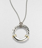 From the Metro Collection. A sleek, sophisticated circle, combining smooth and cabled sterling silver with accents of 18k gold, hangs from a richly textured silver chain and bale. Sterling silver and 18k yellow gold Chain length, about 18 Pendant diameter, about 1¼ Spring ring clasp Imported