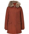 Stylish and sporty with an ultra soft raccoon fur trimmed hood, Woolrichs Arctic down filled parka is a must for cool weather looks - Hood with raccoon fur trim, long sleeves, fitted ribbed knit cuffs, hidden two-way front zip, button placket, buttoned front patch pockets, snapped slit pockets - Contemporary fit, slight A-line silhouette - A versatile, classic coat perfect for both city streets and country slopes