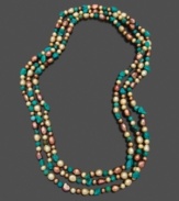 Add a long layer of elegance with a hint of tropical color. Necklace features dyed chocolate cultured freshwater pearls (5-8 mm) and turquoise chips. Approximate length: 64 inches.