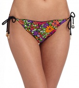 Cheery floral graphics teamed with ruffle edges, make a fun and flirty string bottom.Elastic waistband Side ties with peace charms Ruffle edges Fully lined 82% nylon/18% spandex Fully lined Hand wash Made in USA of imported fabricPlease note: Bikini bottom sold separately. 