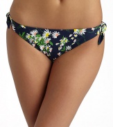 Sunny daisies grow throughout this stretch nylon style with side ties for added charm.Elastic waistband Side ties Fully lined 80% nylon/20% spandex Fully lined Hand wash Made in USA of imported fabricPlease note: Bikini top sold separately. 