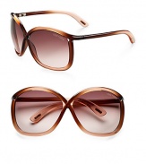 Modern oversized cat eye shaped frames with iconic Tom Ford floating lens and tubular acetate temple. Available in gradient brown/light orange with gradient brown/rose lens.Acetate 100% UV protection Made in Italy 