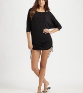 A flattering coverup with side ties for a customizable fit.Round neckThree-quarter sleevesSide tiesCord ends92% polyester/8% spandexHand washImported