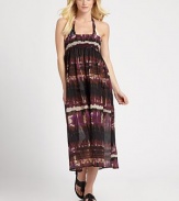 An exotic print meets an elongating, maxi design for the perfect coverup. Smocked topSleevelessCottonHand washImported