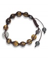 Spiritual-inspired bracelets are all the rage this season! Snap up this hot style from Ali Khan featuring semi-precious tiger's eye beads and pave glass fireballs on a trendy brown cord. Bracelet adjusts to fit the wrist. Approximate diameter: 2 inches. Approximate length: 12-1/4 inches.