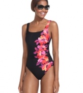 A tropical floral print brightens up Miraclesuit's flattering ruched one-piece tank suit.