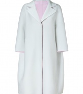 A luxurious example of the contemporary Jil Sander look, this pristine chalk cashmere coat is a statement investment for modern-minimalist wardrobes - Notched lapel, 3/4 dolman sleeves, dropped shoulders, hidden front snaps, side slit pockets, rose unlined interior - Oversized boxy retro silhouette - Team with monochrome separates and jet black accessories