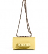 Inject a dose of hard-edge elegance into your outfit with Valentinos soft yellow leather tonal rockstud shoulder bag, detailed with a front handle perfect for converting into a covetable clutch - Flap with magnetic snap closure underneath, tonal rockstud-adorned front handle, removable chain-link shoulder strap, accordion style with 2 internal sections, inside back wall credit card slot - Carry as a polish to cocktail dresses or tailored separates