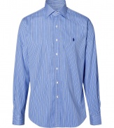 Anchor your wardrobe with elegant indispensables like Polo Ralph Laurens smartly striped dress shirt - Crafted in a pure, blue cotton poplin - Classically slim, straight cut - Kent collar, long cuffed sleeves and full button placket - Iconic embroidered polo pony logo at chest - Versatile and polished, a must for both work and weekend - Pair with a suit, or go for a more casual look with chinos and jeans