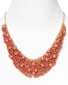 Brighten up every outfit with this layered beaded bib necklace from Cara accented by a dramatic collar of coral stones.